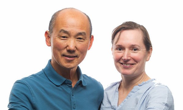 a man and woman smiling for a picture